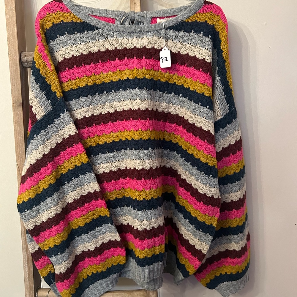 Colorful striped sweater with bow on back